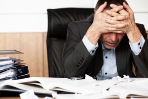 Worker feeling anxious and depressed at his desk