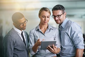 Cropped shot of three businesspeople working on a digital tablethttps://195.154.178.81/DATA/i_collage/pi/shoots/783721.jpg