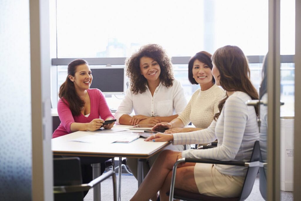 Female workers discussing wages